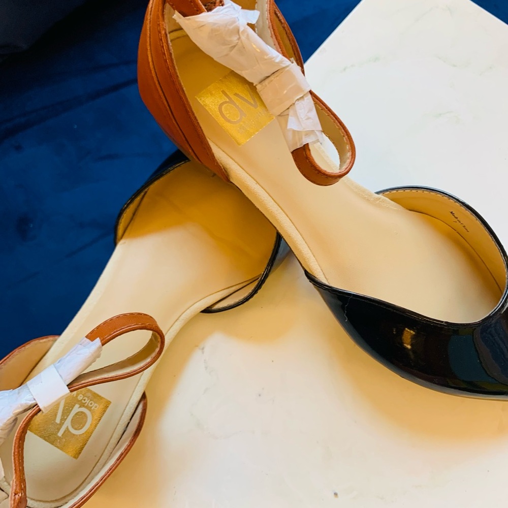 Dolce Vita Black and Tan Flats Classic Elegance